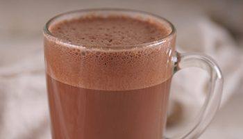A glass filled with hot chocolate