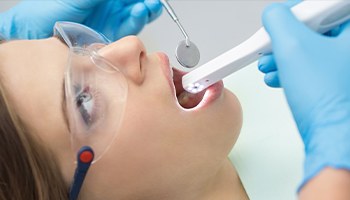 woman being treated with the Intraoral camera