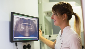 dentist looking at digital xrays
