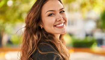 Closeup of woman smiling outside