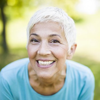 older woman with dentures in Metairie grinning from ear to ear 