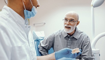 man asking his dentist in Metairie questions about dentures 