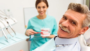 older man at a consultation for dentures 