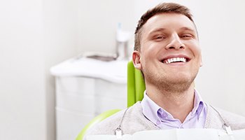Close-up of a male dental patient smiling