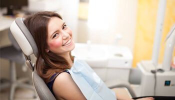 Smiling woman in dental chair