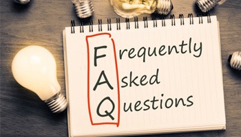 a notepad with “FAQ” written in it