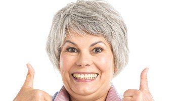 older woman grey hair thumbs up