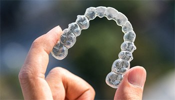 Holding clear aligner