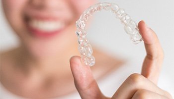 Holding clear aligner