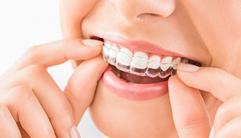 young girl brushing teeth