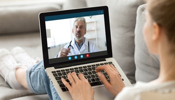 Person speaking with a virtual consult dentist in Metairie, LA.