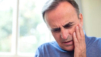 An older man with tooth pain.