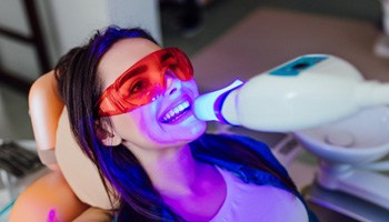 a woman having her teeth whitened