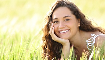 Young woman smiling after cost of teeth whitening in Metairie